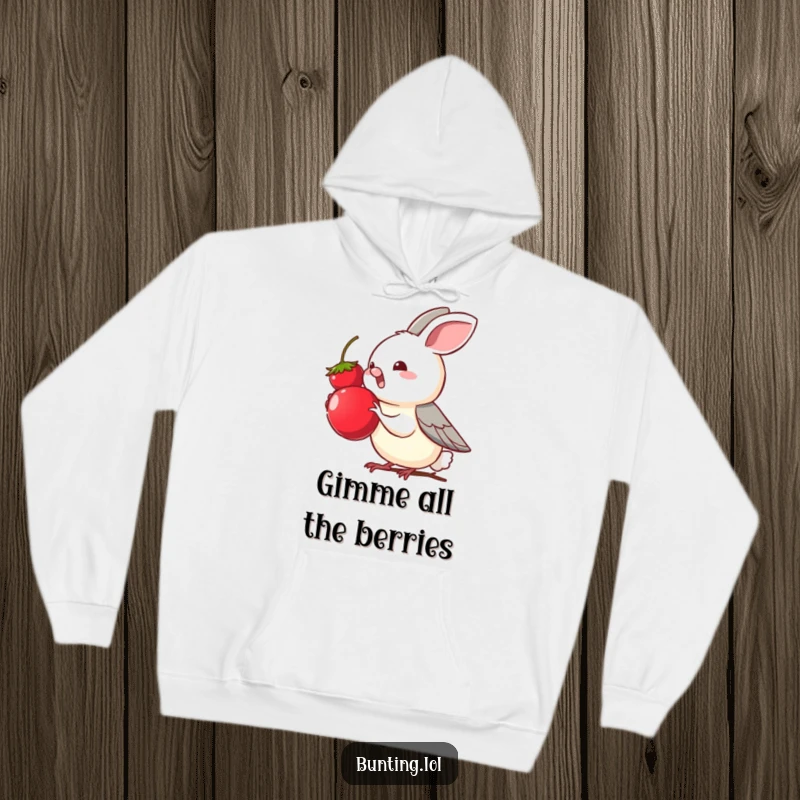 Funny bunting bird character eagerly reaching for a tempting berry, depicted on a cozy hoodie, embodying a love for treats.