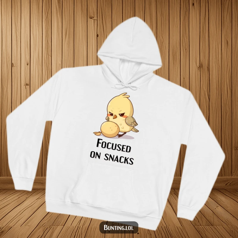 Funny Hoodie with a small bird character displaying determination while pecking at a large seed, offering warmth and a motivational vibe.