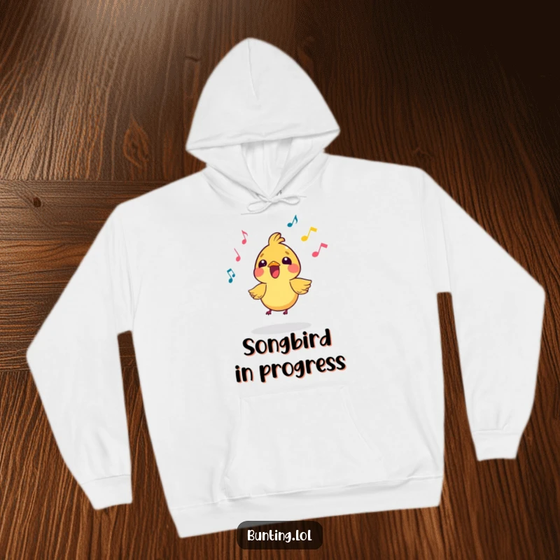 Funny Hoodie with a small, vibrant bird character joyfully singing amidst flowing musical notes, offering comfort and a cheerful vibe.